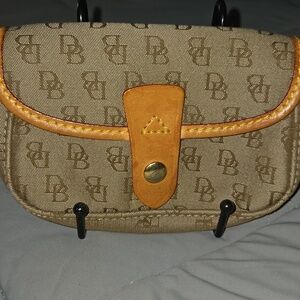 Dooney & Bourke Vintage Signature monogram flap wristlet featuring brown leather